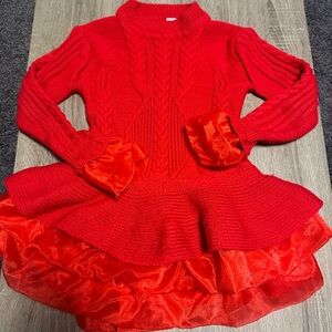 Adorable red children’s cable knit tutu sweater with tulle and bell sleeves